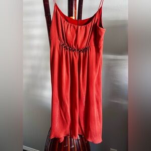 Elegant Red Sleeveless Dress with Beaded Detail